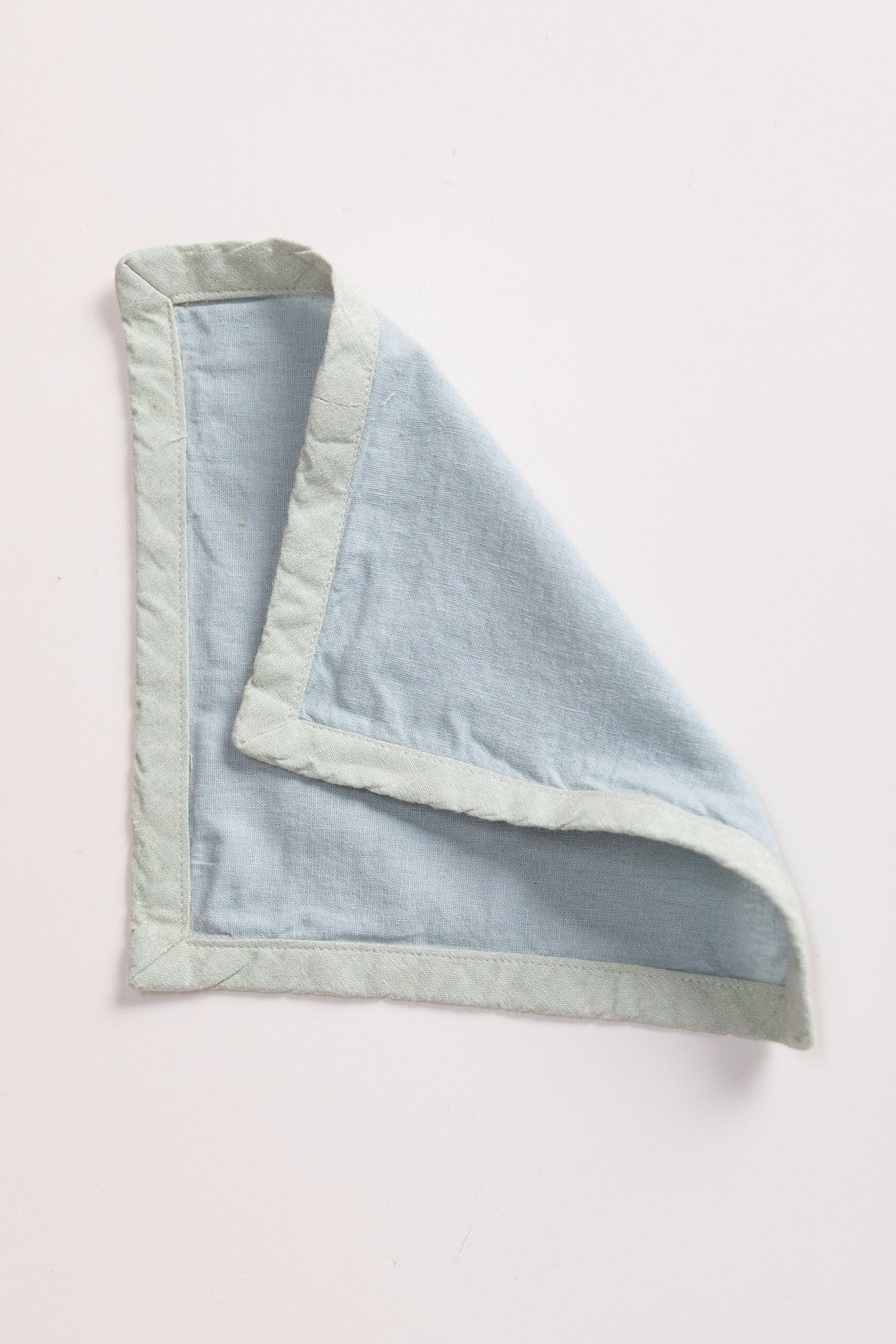 EDGED COCKTAIL NAPKINS IN MIST LINEN - SET OF FOUR