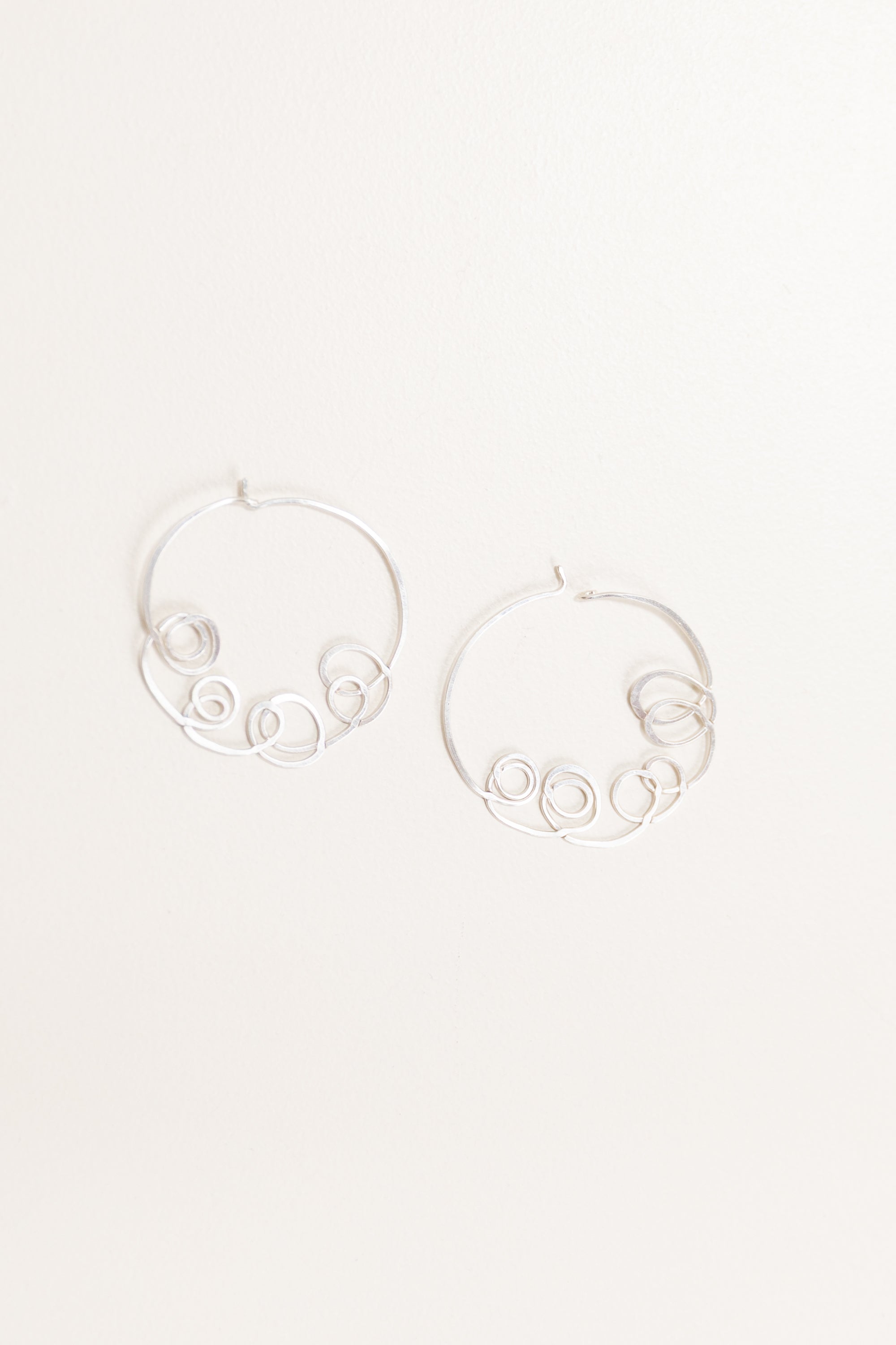 LOOPY HOOPS IN STERLING SILVER