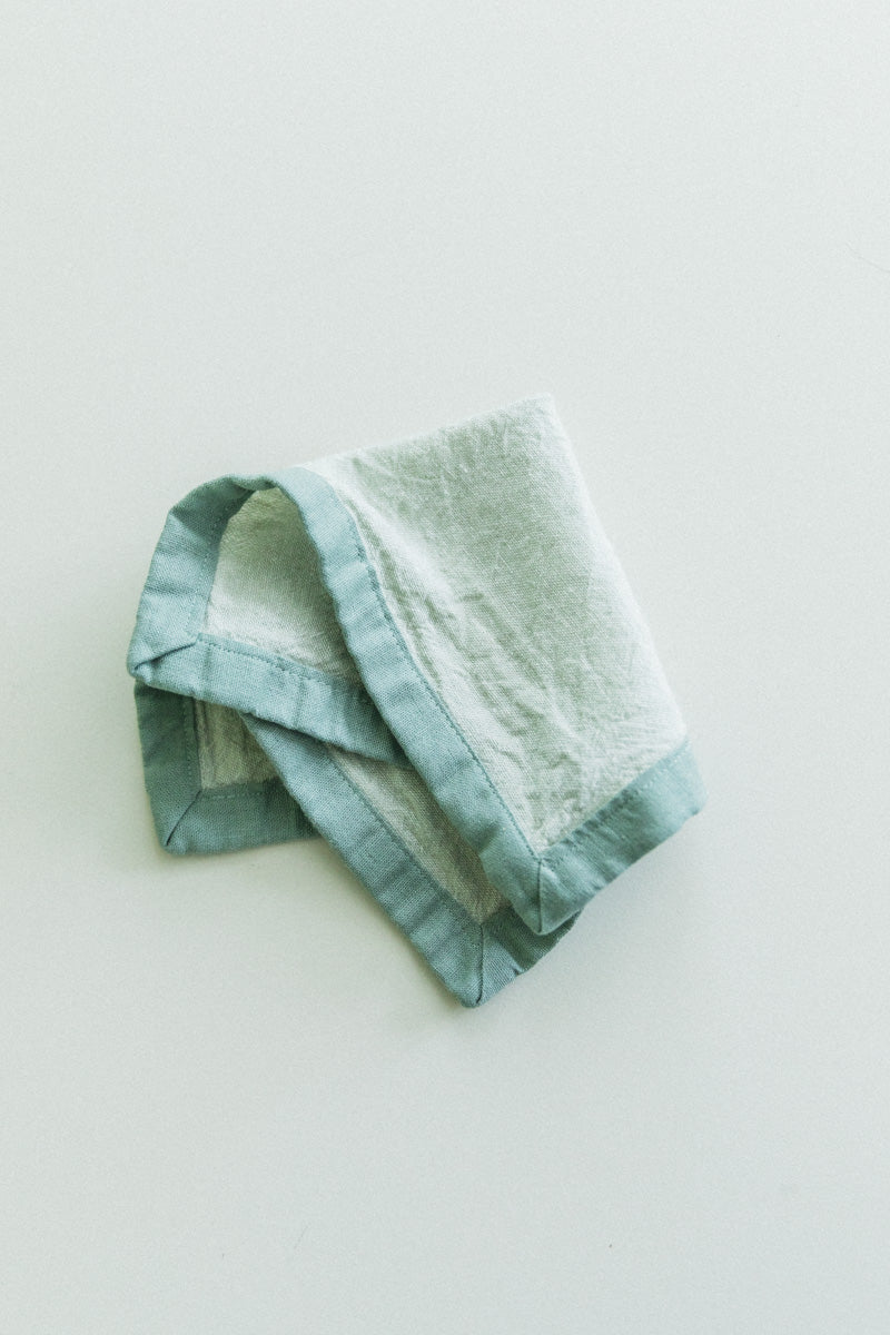 EDGED COCKTAIL NAPKINS IN MOSS LINEN - SET OF TWO