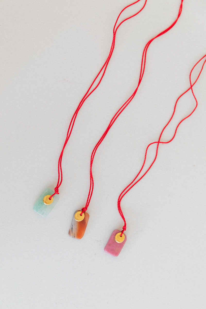 SOL NECKLACE ON A SILK CORD