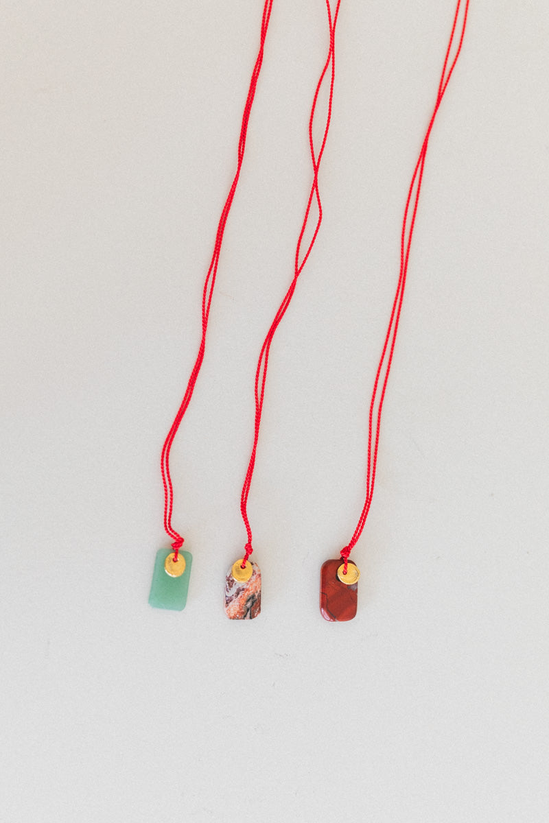 SOL NECKLACE ON A SILK CORD