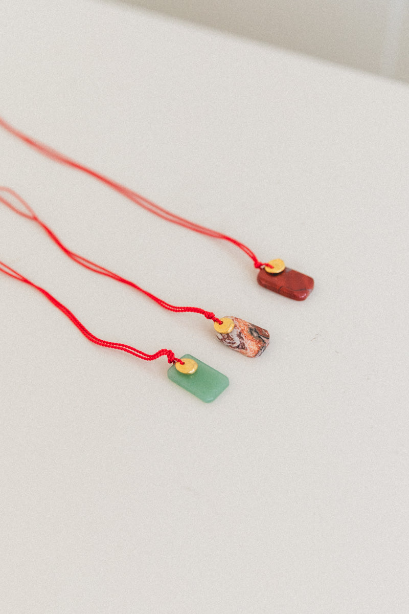 SOL NECKLACE ON A SILK CORD