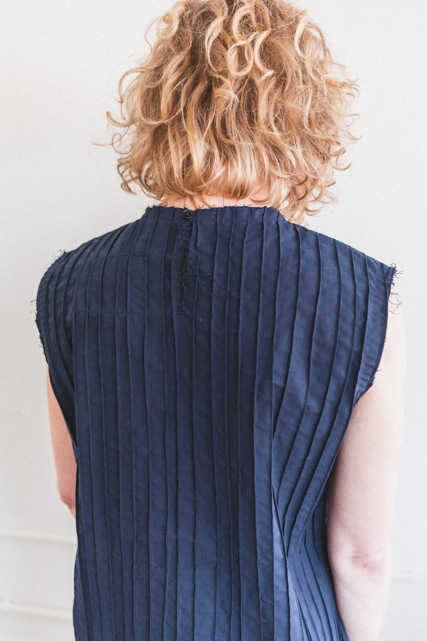 HAND PLEATED COCKTAIL DRESS IN NAVY