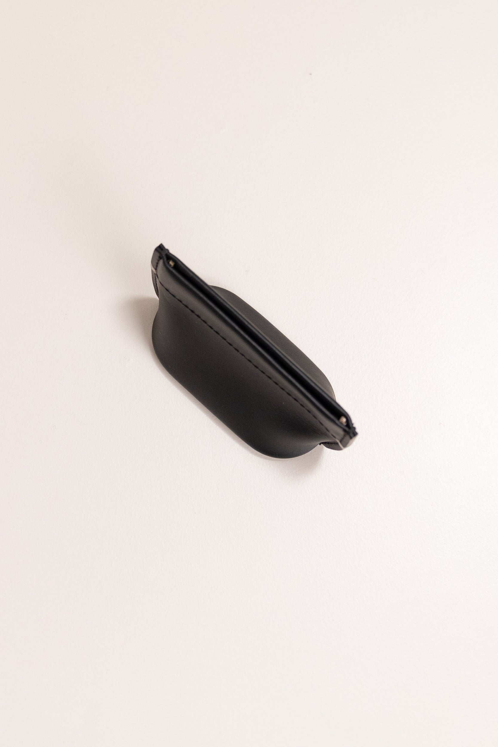 COIN DUMPLING IN BLACK LEATHER