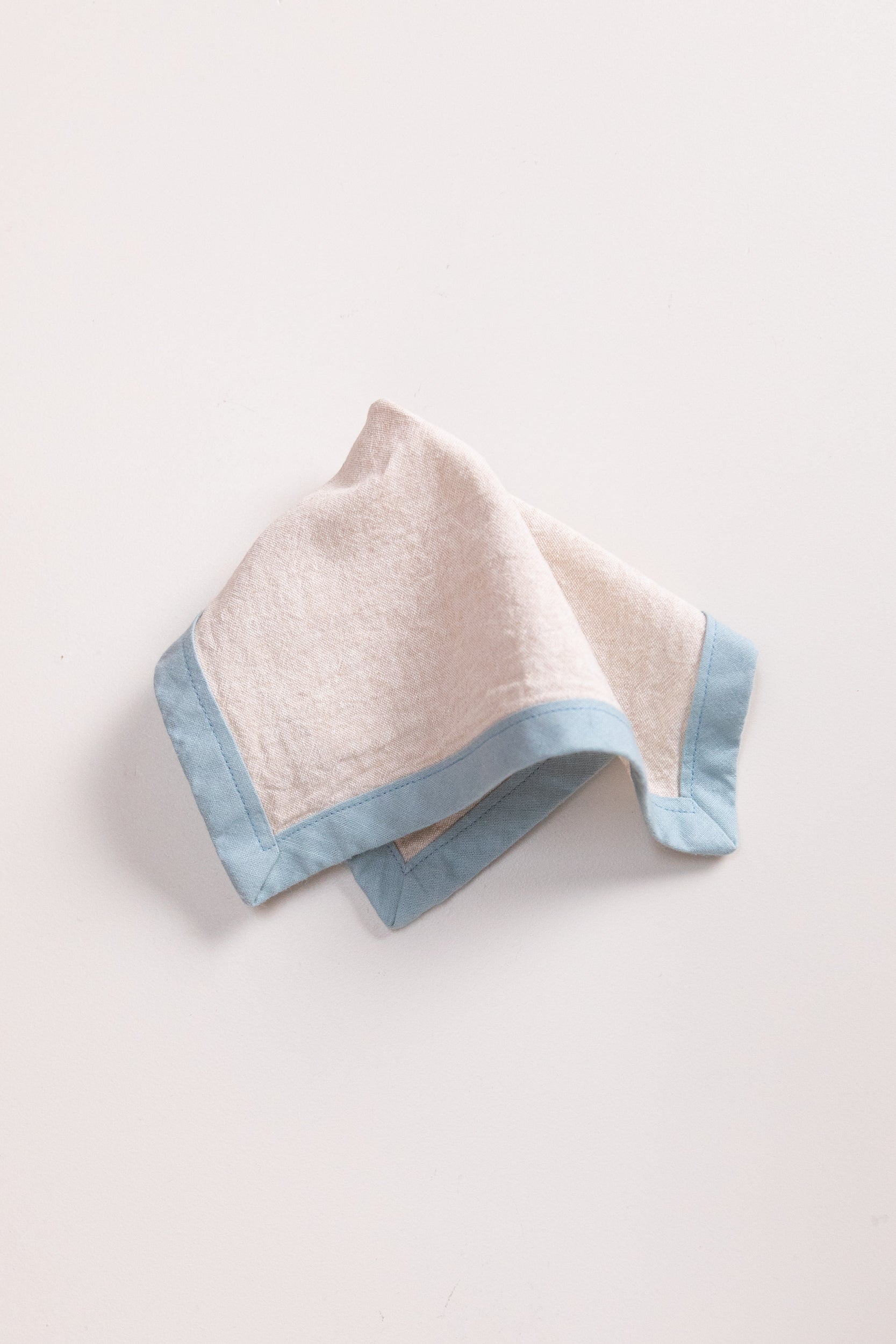 EDGED COCKTAIL NAPKINS IN CREAM LINEN - SET OF FOUR