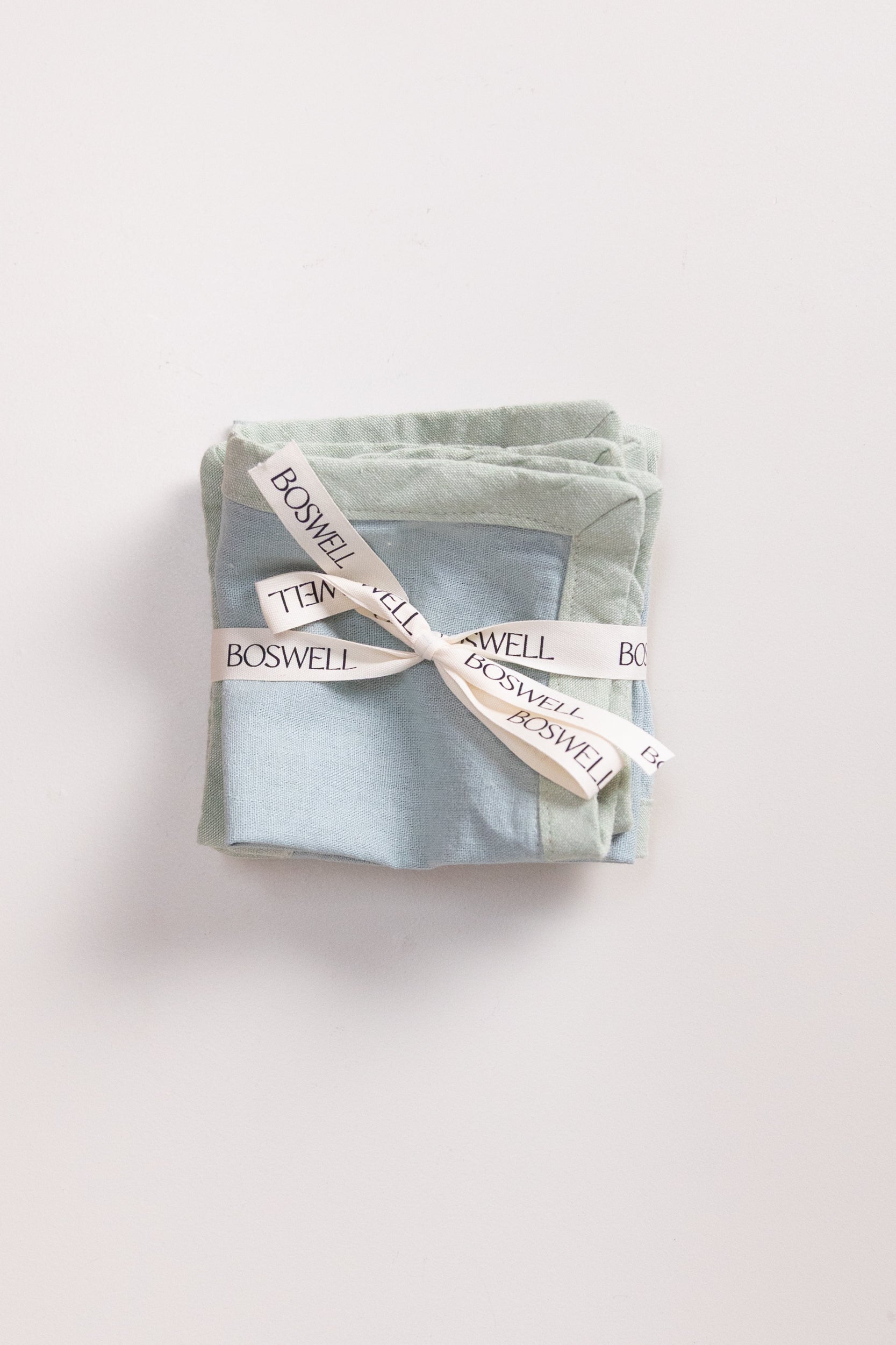 EDGED COCKTAIL NAPKINS IN MIST LINEN - SET OF FOUR