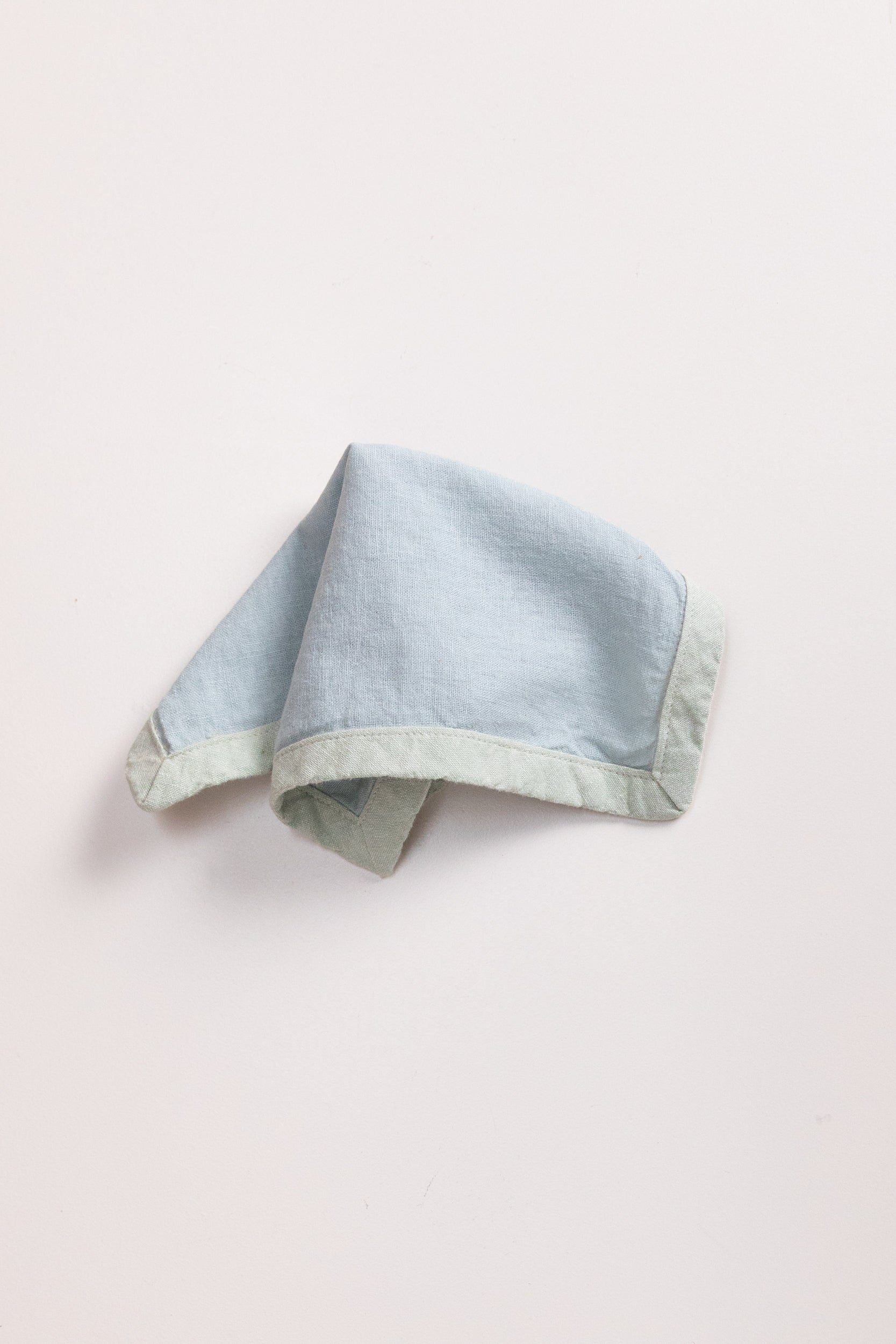 EDGED COCKTAIL NAPKINS IN MIST LINEN - SET OF FOUR