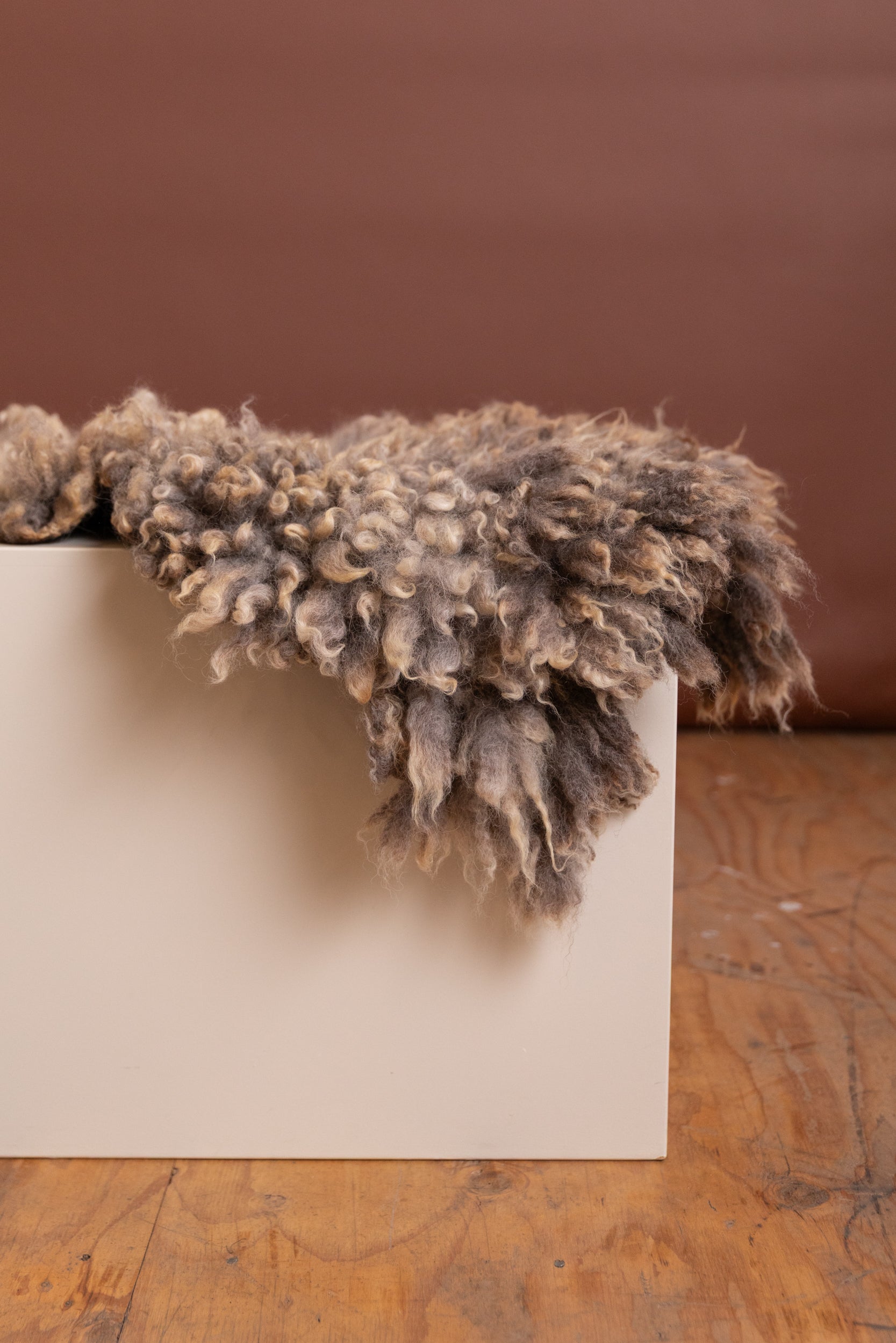 FELTED BENCH CUSHION IN NATURAL UNDYED WOOL