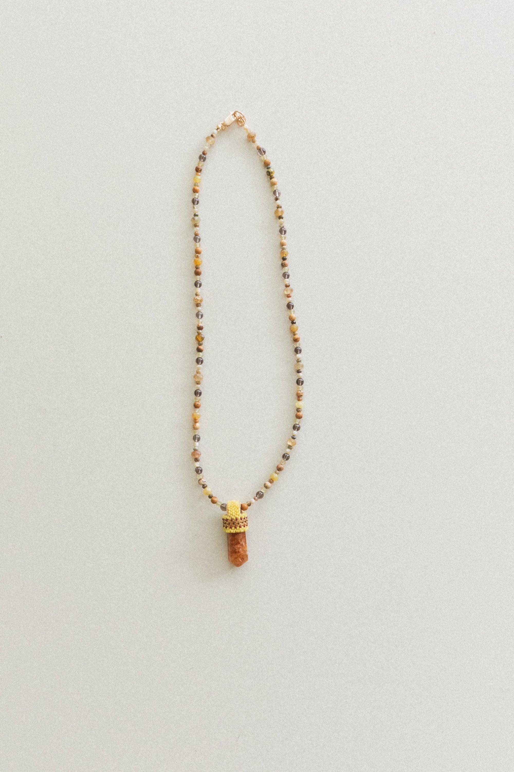 PEACE OF MIND NECKLACE WITH A CITRINE CRYSTAL PENDANT